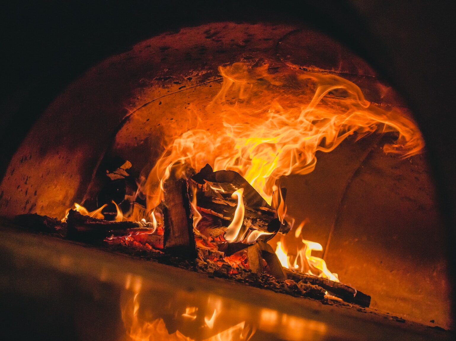 burning firewood in fire pit